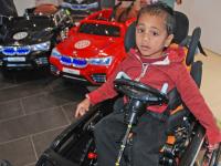 Three-year-old Ezekial can now drive himself, thanks to an adaptation which slots his wheelchair seat into his own electric BMW 